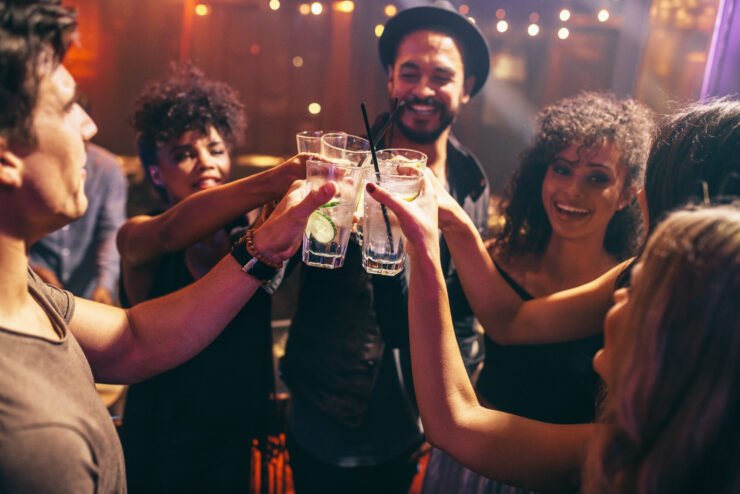 Food-and-drink-pr-shot-of-a-group-of-millennials-drinking-at-a-bar