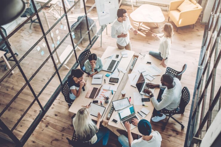 Consumer-pr-agency-team-meeting-around-a-modern-office-table