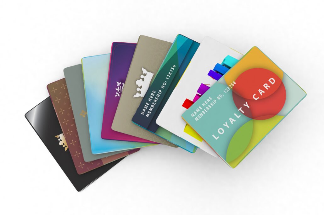 A-collection-of-loyalty-cards-fanned-out-on-a-white-surface
