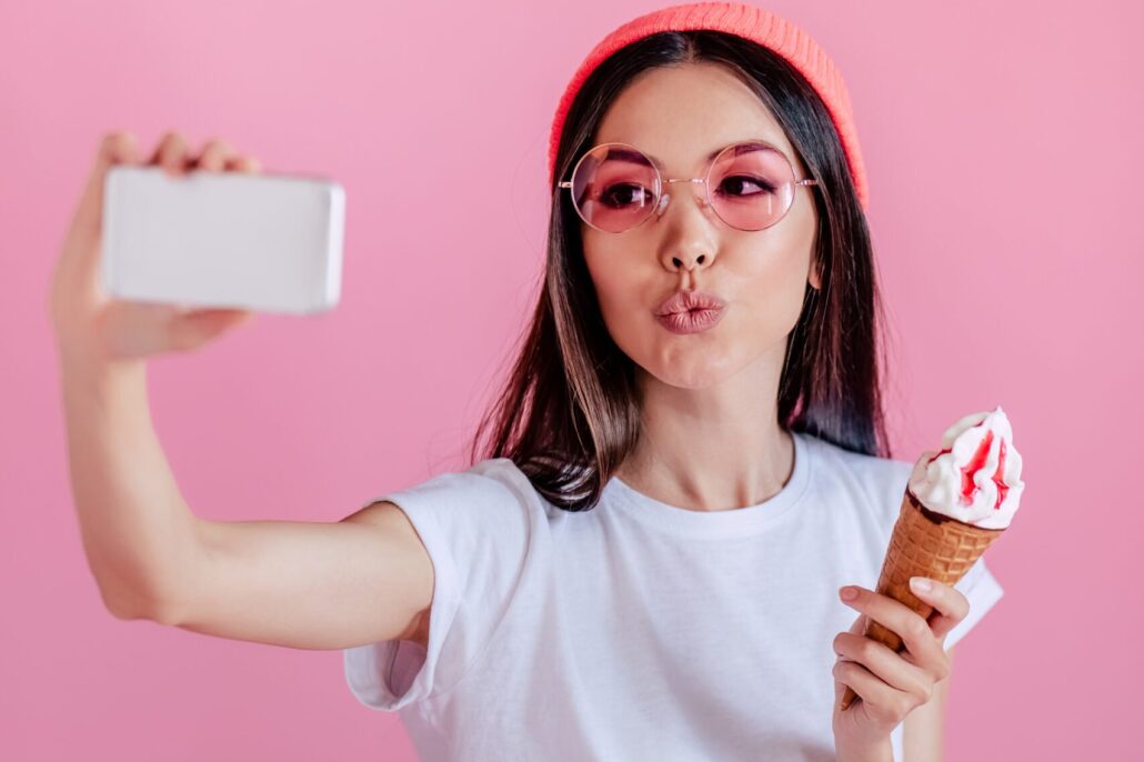Female-Food-PR-influencer-capturing-content-of-eating-an-ice-cream