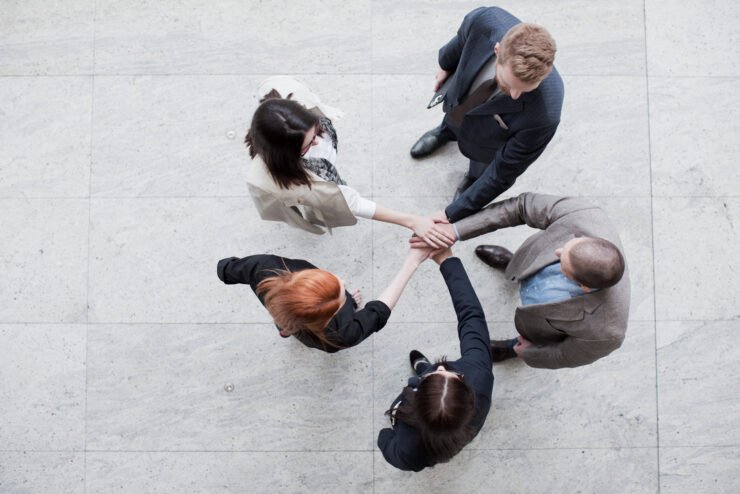 Consumer-pr-agency-team-joining-hands-in-a-circle