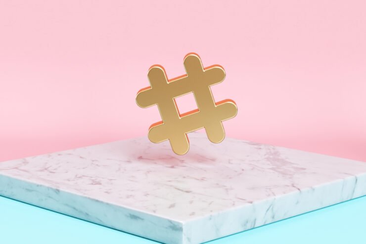 golden-hashtag-statue-placed-on-white-marble-countertop