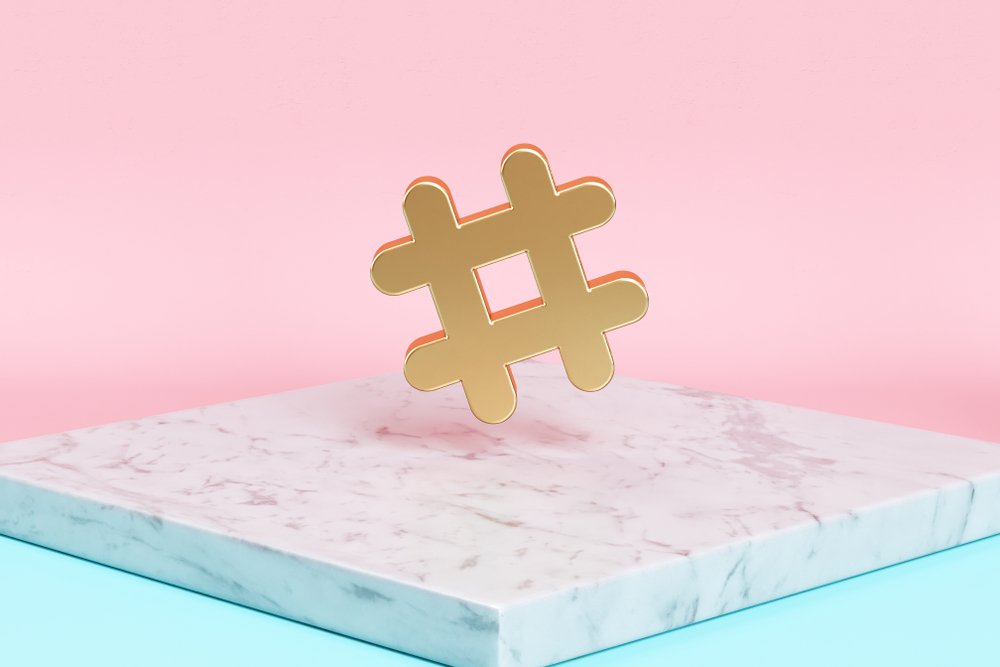 golden-hashtag-statue-placed-on-white-marble-countertop