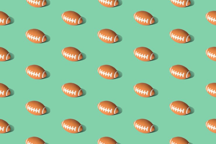 American-football-ball-pattern-on-green-background