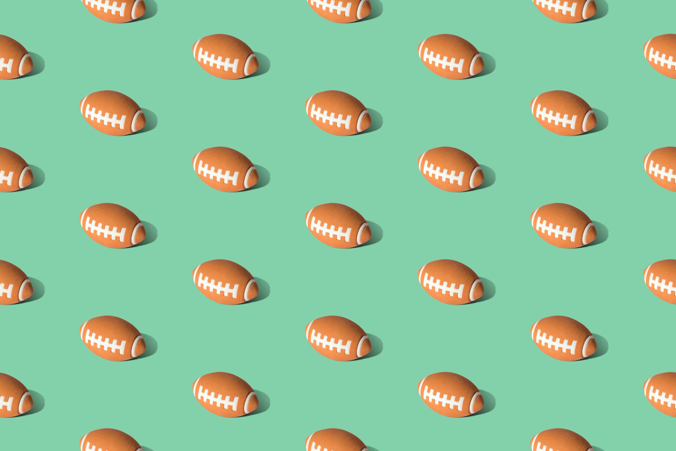 American-football-ball-pattern-on-green-background