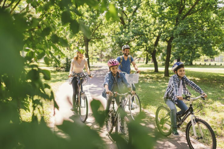 Family-riding-bicycles-in-the-public-park-together