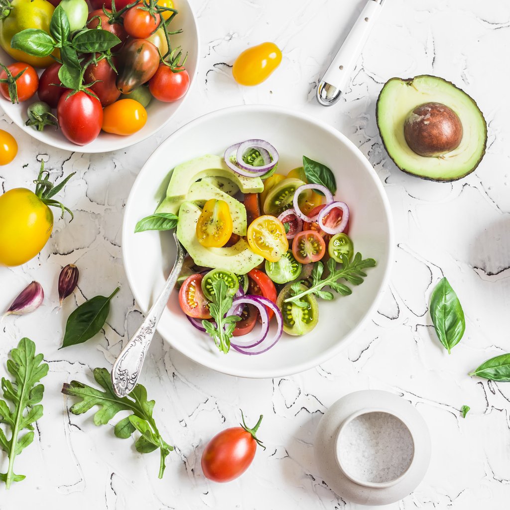 Consumer-PR-shot-of-a-full-salad-bowl-and-a-bowl-of-tomatoes