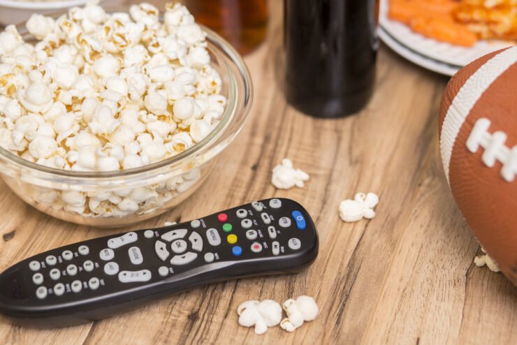 Consumer-PR-shot-of-popcorn-bowl-and-TV-remote-to-show-watching-the-super-bowl