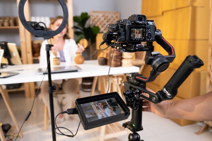 Behind-the-scenes-of-a-woman-live-streaming-via-professional-camera