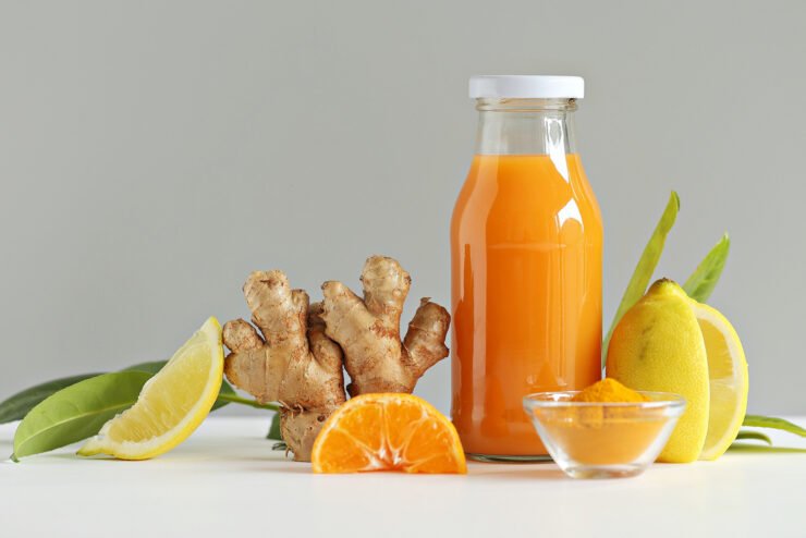 Ginger-health-juice-shot-with-citrus-fruits-turmeric-and-honey-Immunity-system-booster-food-health-trends