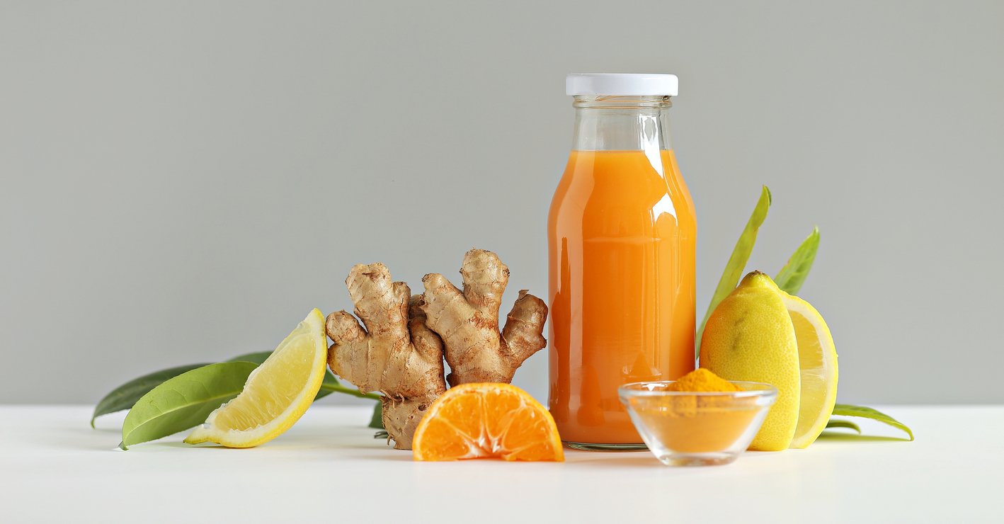 Ginger-health-juice-shot-with-citrus-fruits-turmeric-and-honey-Immunity-system-booster-food-health-trends