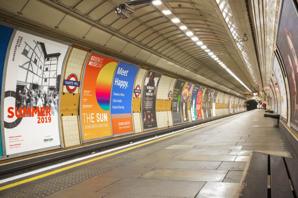 Empty platform at Gants Hill London Underground station advertising posters marketing campaigns